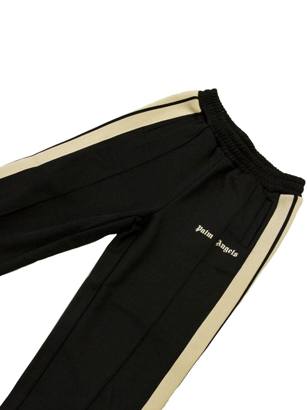 Pantaloni per bambino Palm Angels Kids con bande - Ninna Nanna